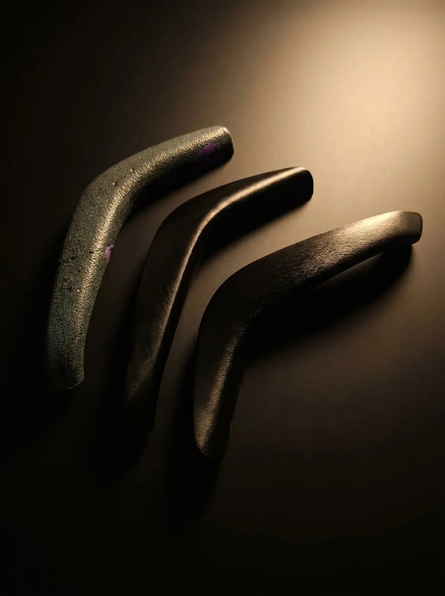 Three reverse-engineered Mercedes-Benz CLK 200 door handle pull trims in different finishes